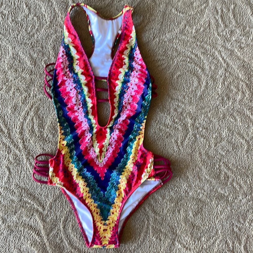 Multi colored one piece bathing suit.